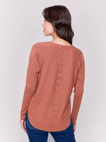 Charlie B Light Weight Sweater With Front Pockets And Back Eyelet Detail Terracotta